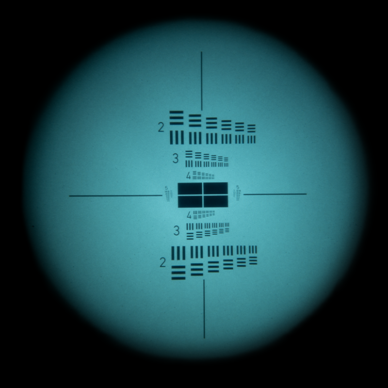 Lab night vision view through the Night Operators PVS-14 showing measured resolution chart performance